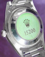 rolex with green sticker on back